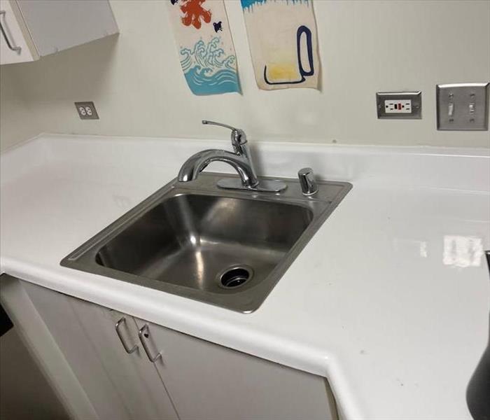 Sink filled with sewage cleaned out and disinfected